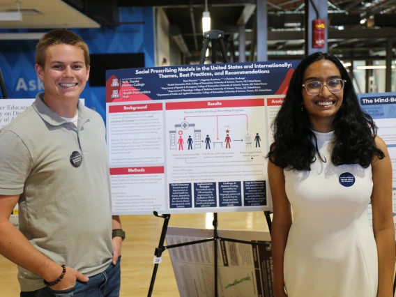 H3 Interdisciplinary Scholars Ryan Haymore and Nagasriya Ramisetty present their research project.  