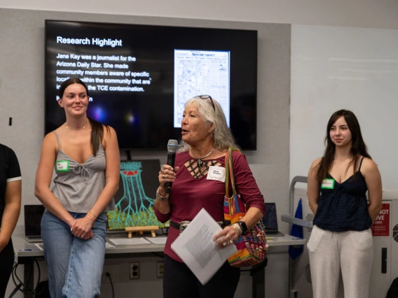 Yolanda Herrera speaks with Applied Humanities students during their final showcase.